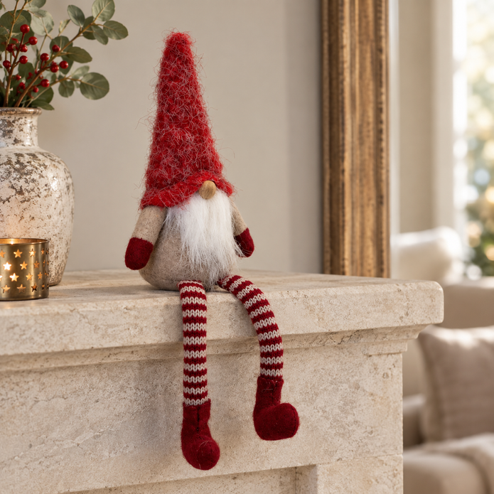 Sitting Red Woolly Christmas Gonk styled in a warm neutral Christmas interior