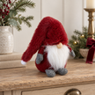 Deep Red Christmas Gonk styled in a warm neutral Christmas interior