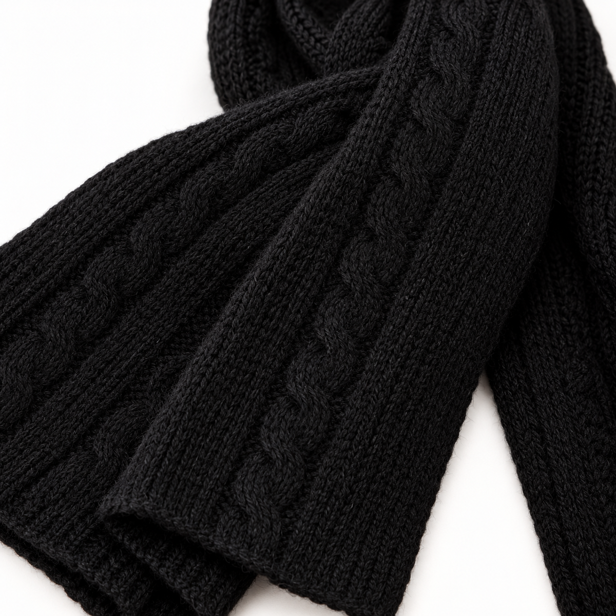 Close-up of the soft black cable knit scarf texture