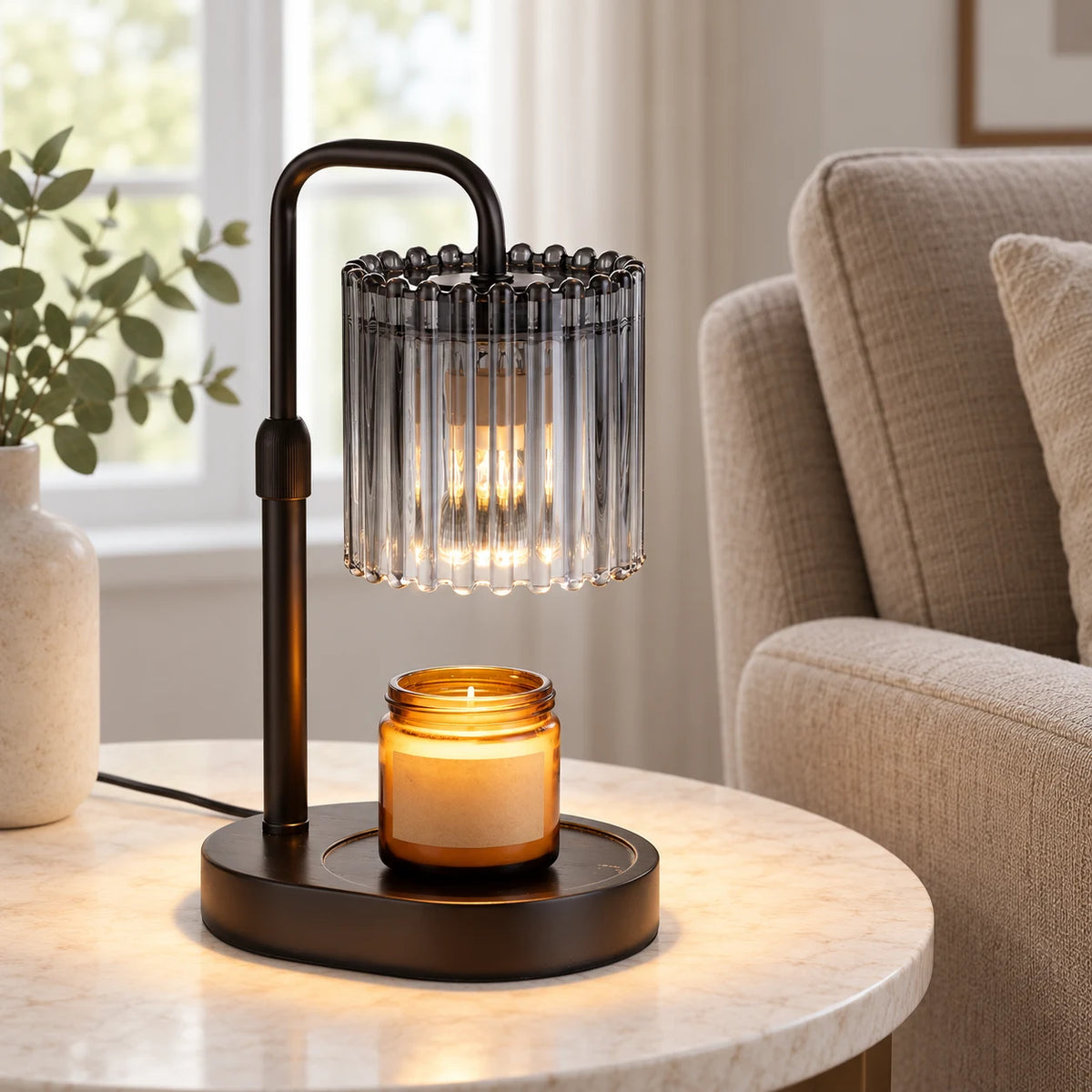 Black glass candle warmer lamp on a side table in a neutral reading room