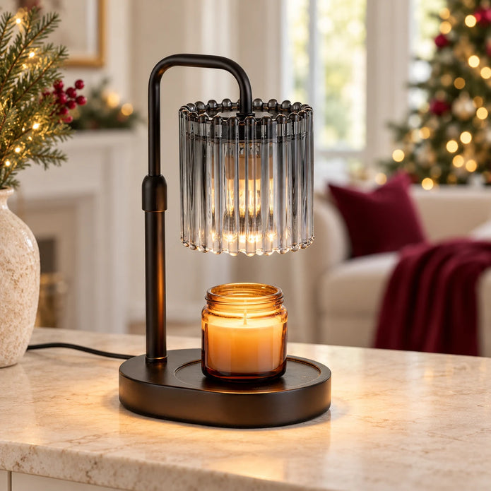 Black candle warmer lamp with smoky crystal-style glass shade on a cream console