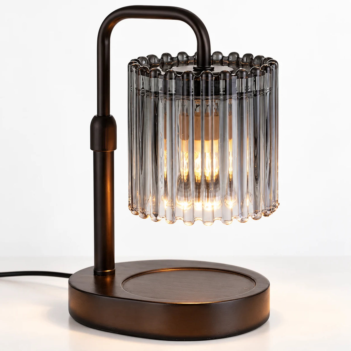 Close-up of the smoky vertical glass rods on the black crystal-style candle warmer shade