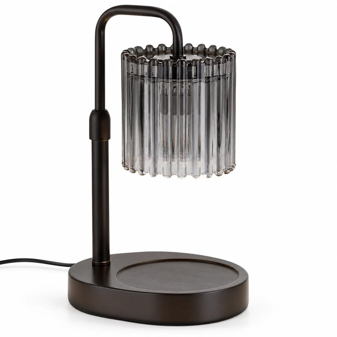Black candle warmer lamp with crystal-style glass shade on a white studio background