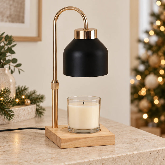Black enamel effect shade candle warmer with unlit jar candle in a neutral Christmas room