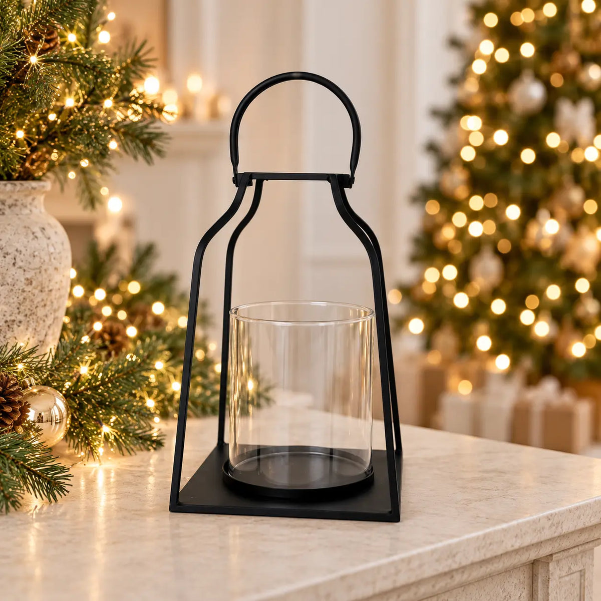 Large black metal Satchville candle lantern on a table