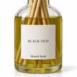 Black Oud Reed Diffuser close-up of the fragrance label and glass bottle.