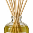 Black Oud Reed Diffuser close-up of natural rattan reeds and the glass bottle neck.