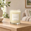 Heaven Scent Black Oud Medium Candle unlit on an oak console