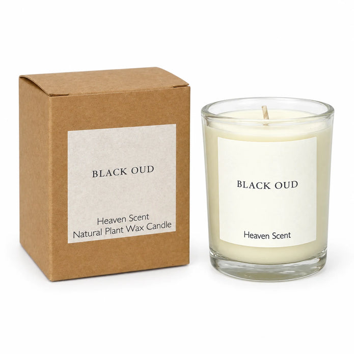 Heaven Scent Black Oud Small Candle unlit with its kraft box on white