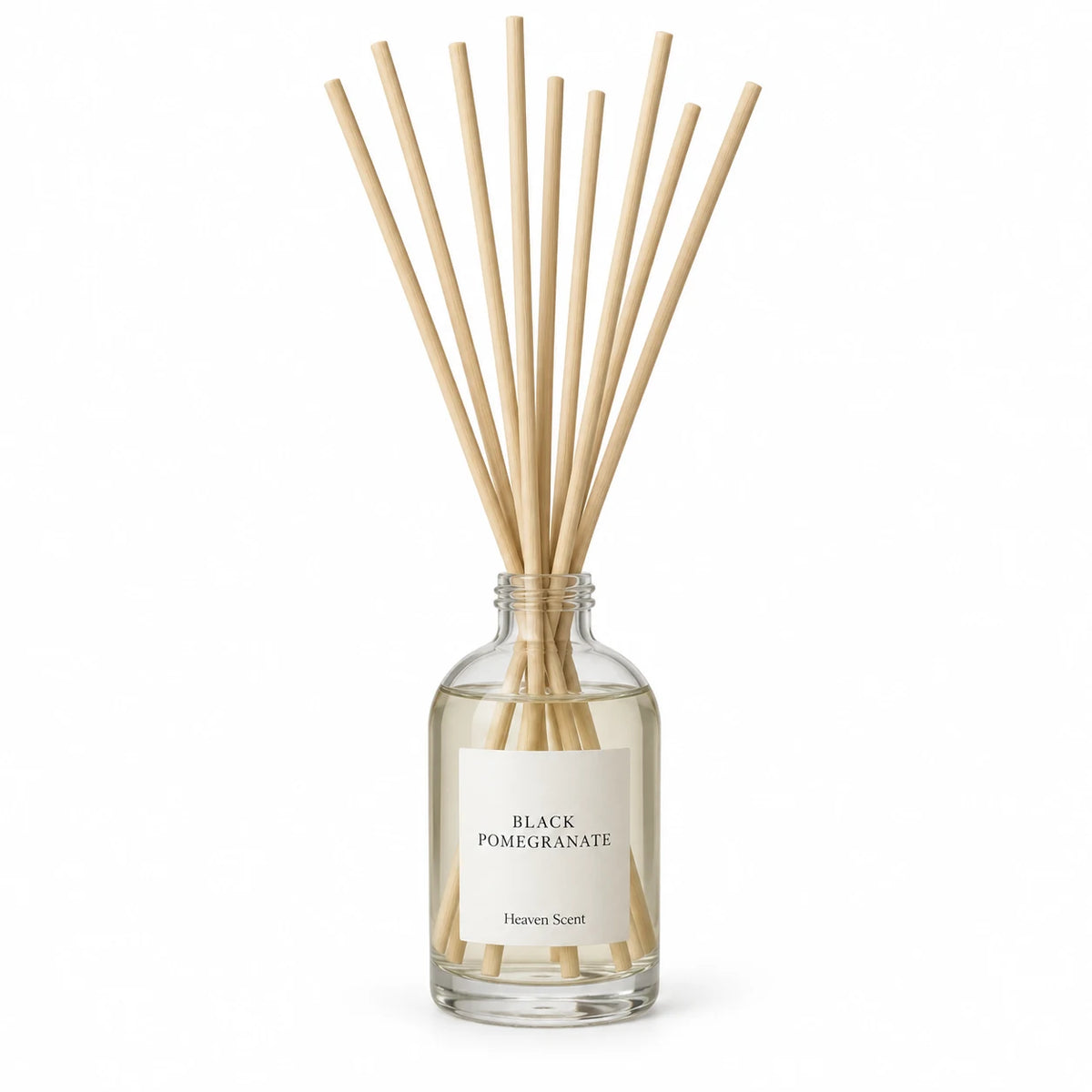 Black Pomegranate Reed Diffuser on white with natural reeds inserted.
