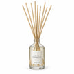Black Pomegranate Reed Diffuser on white with natural reeds inserted.