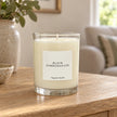 Heaven Scent Black Pomegranate Medium Candle unlit on an oak console