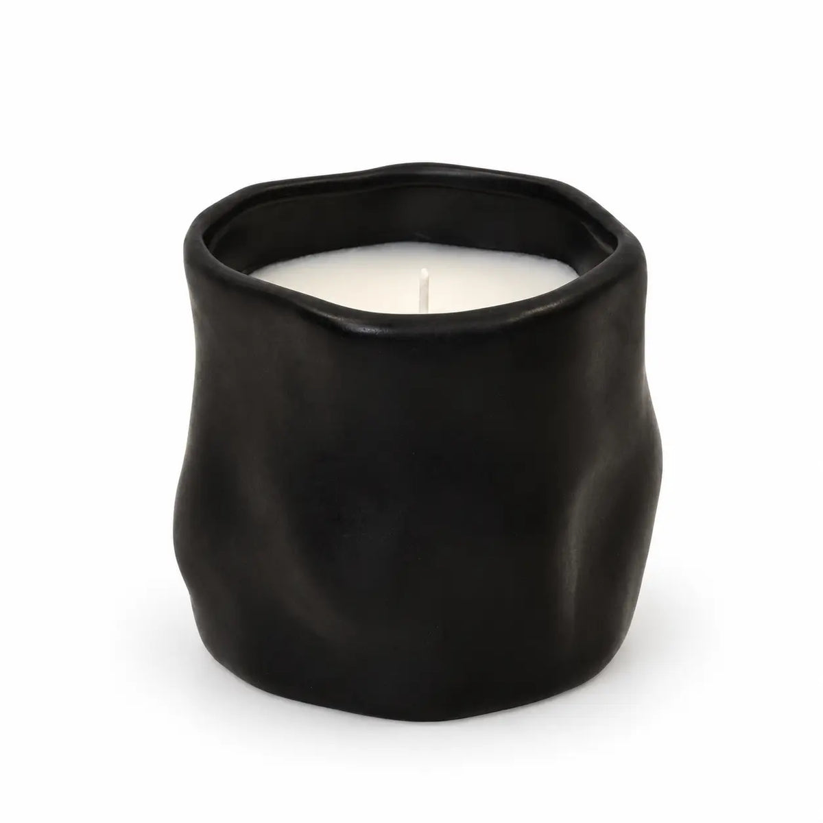 Full black sculpted candle with white wax and unlit wick on a white background