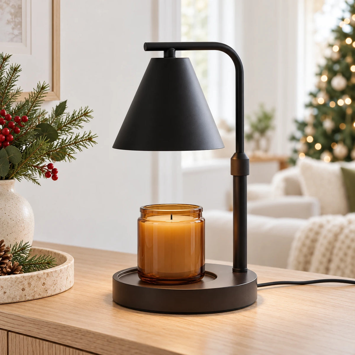 Black shade candle warmer lamp styled with an unlit amber jar candle on a Christmas console