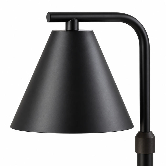 Close-up of the tapered black lampshade, suspension fitting and curved support arm