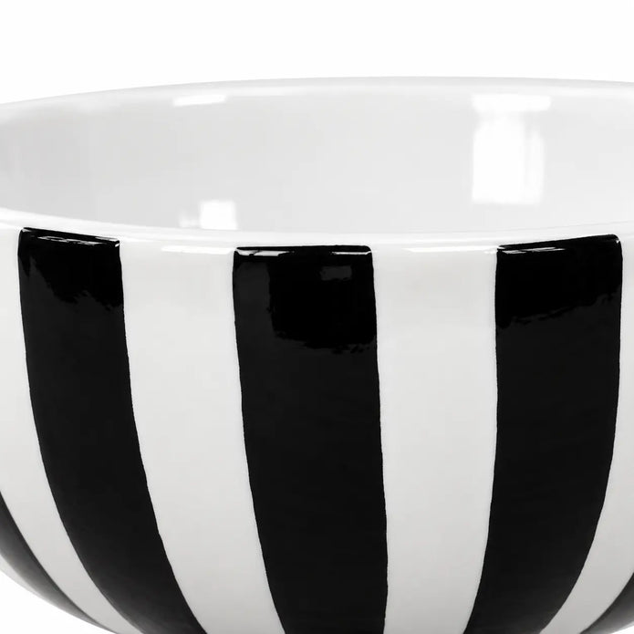 Close-up of glossy black and white stripes and the bowl's plain white interior