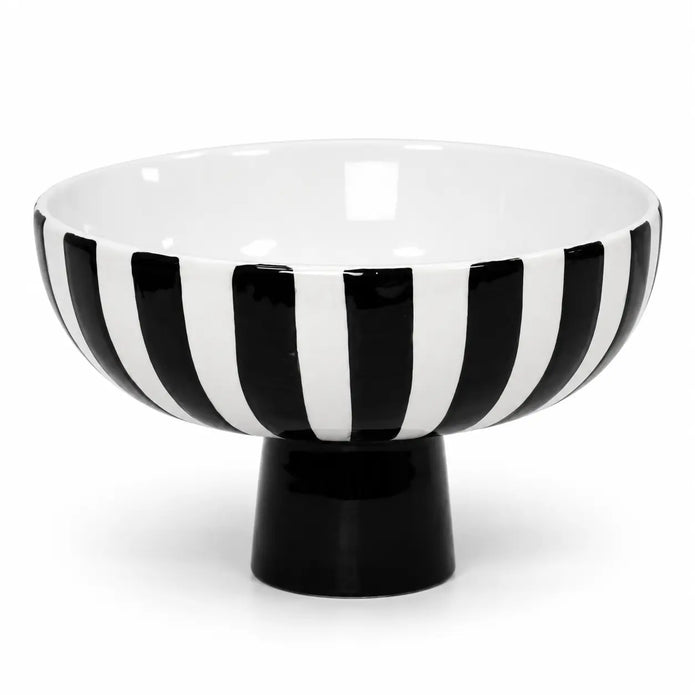 Full black and white striped ceramic bowl with solid black foot on a white background