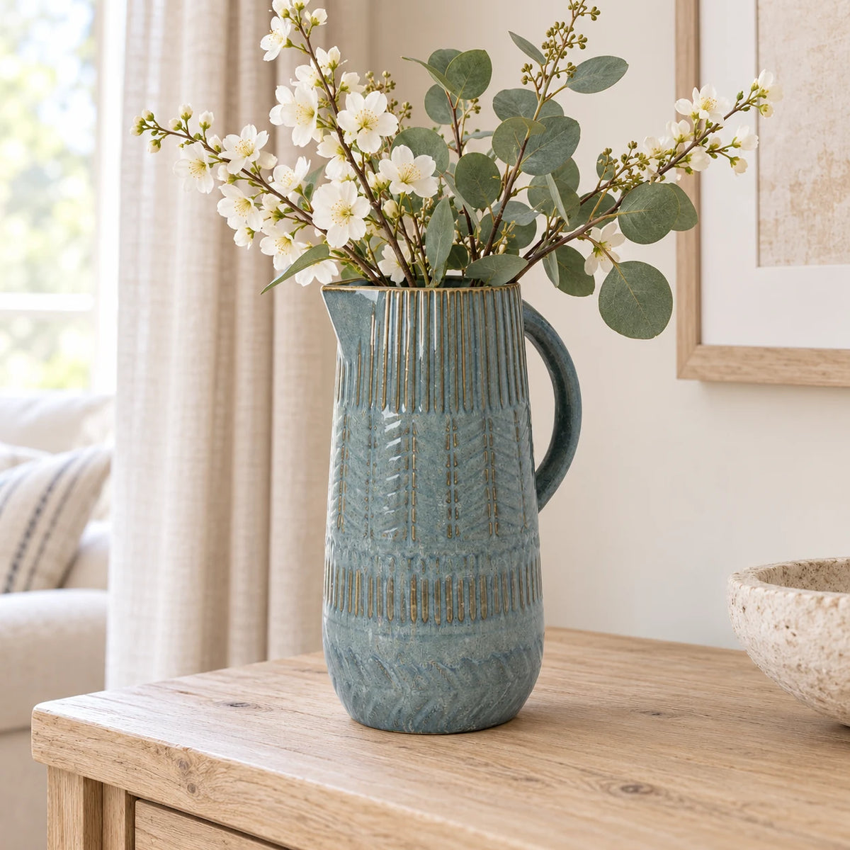 Large 32cm blue ceramic jug with mottled glaze and textured bands, console view.
