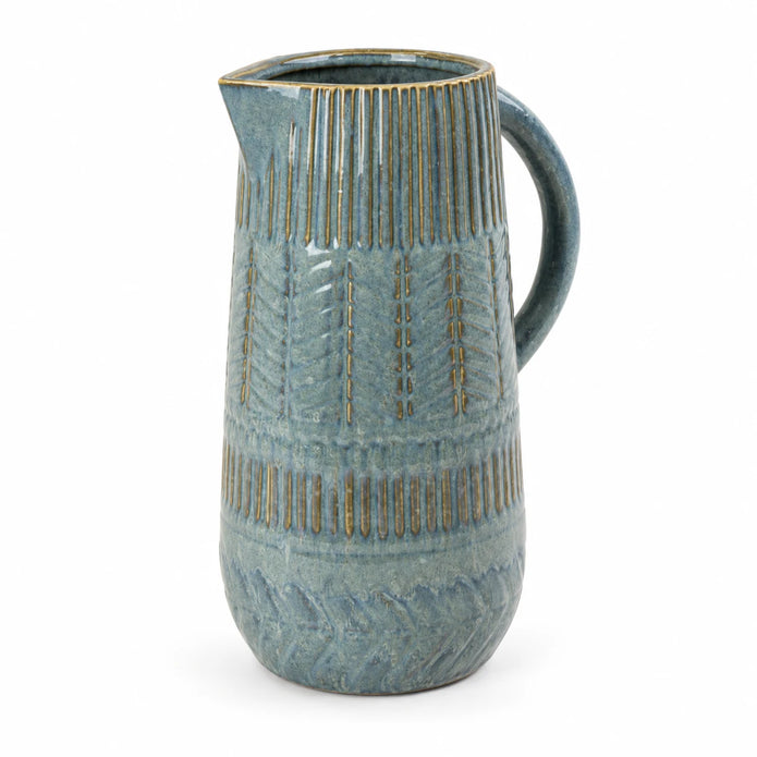Large 32cm blue ceramic jug with mottled glaze and textured bands, studio view.