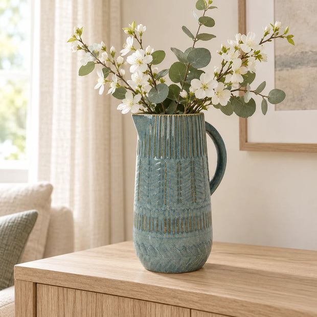 Medium blue ceramic jug by Satchville, showcasing a smooth, curved design perfect for decorative or functional use.