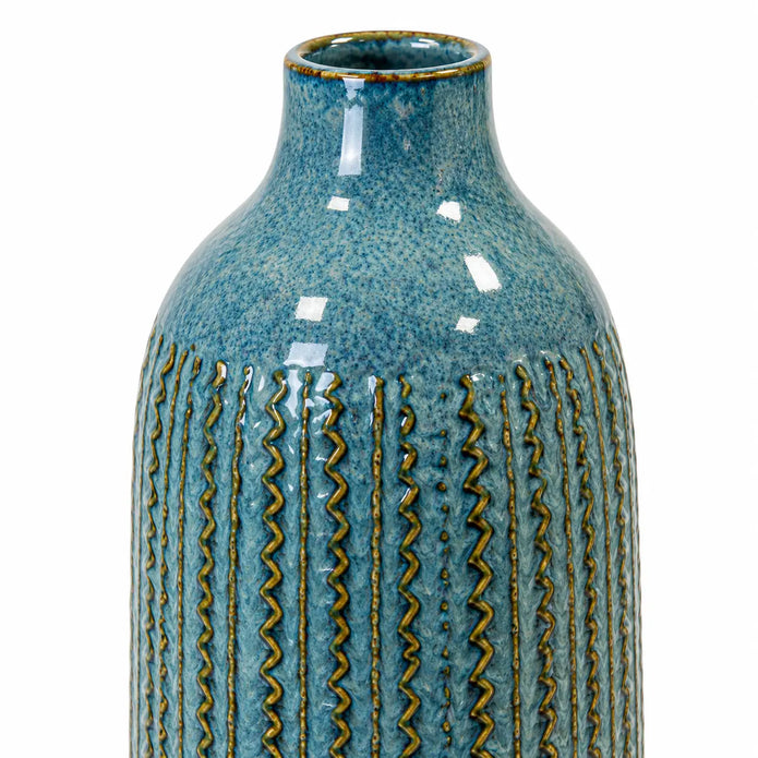 Large blue ceramic vase close-up of the glazed neck and textured ceramic body.
