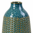 Medium blue ceramic vase close-up of the glazed neck and textured ceramic body.