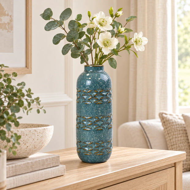 Blue ceramic vase, slender 26cm design with three textured bands, console view.