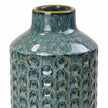Small blue ceramic vase close-up of the glazed neck and textured ceramic body.