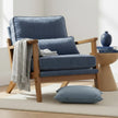 Blue Retro Wooden Framed Arm Chair, blue cushioned wooden armchair beside a throw and side table