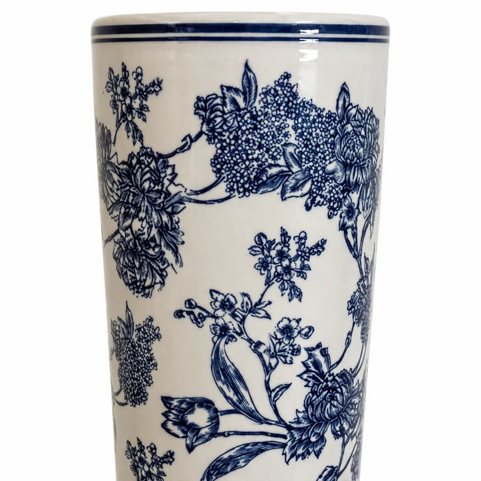 Close-up of navy floral decoration and double blue rim on the magnolia umbrella stand