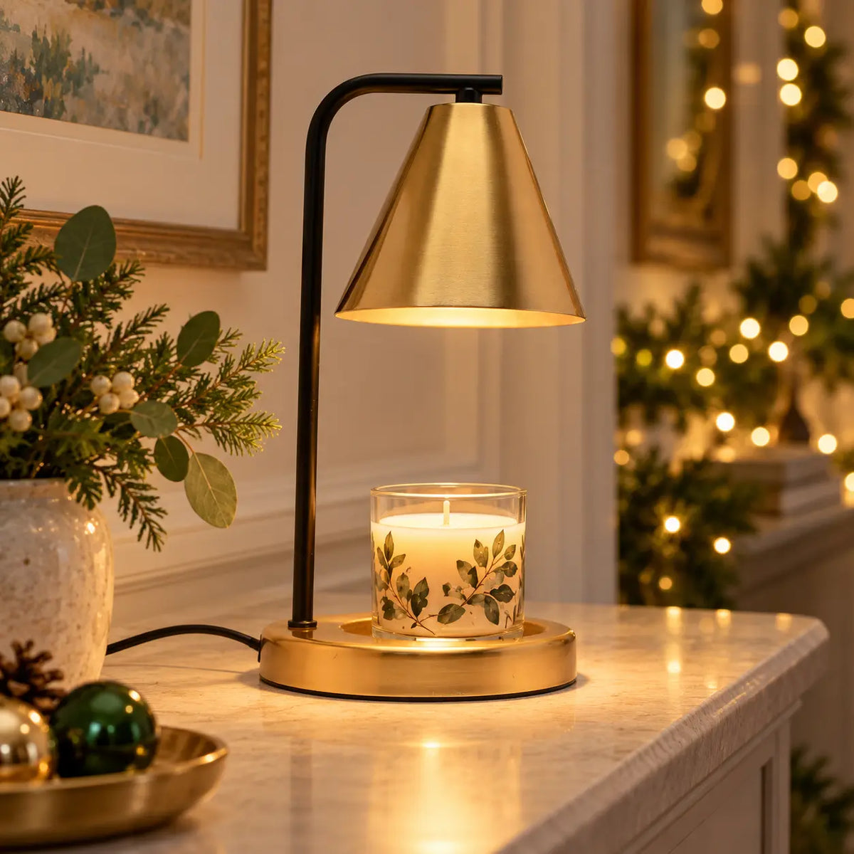 Black and brass-effect candle warmer lamp glowing above an unlit candle on a console