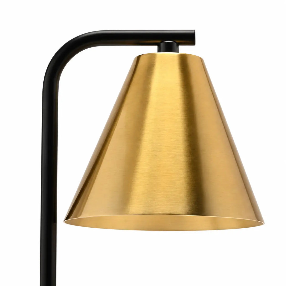 Close-up of brushed brass-effect conical shade and black curved arm on a candle warmer lamp