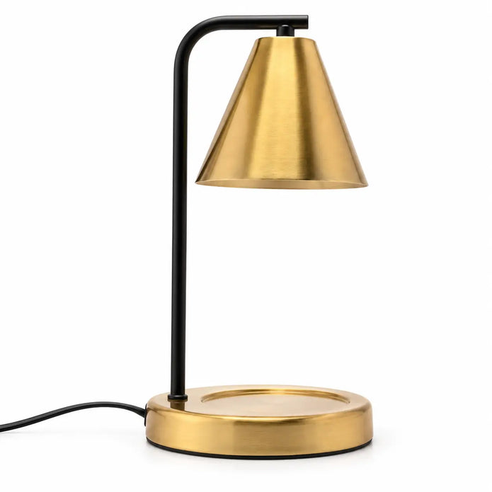 Brass-effect candle warmer lamp with conical shade, black stem and circular base on white