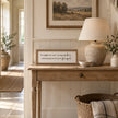 To Nights framed sign styled on an oak console in a classic modern country hallway