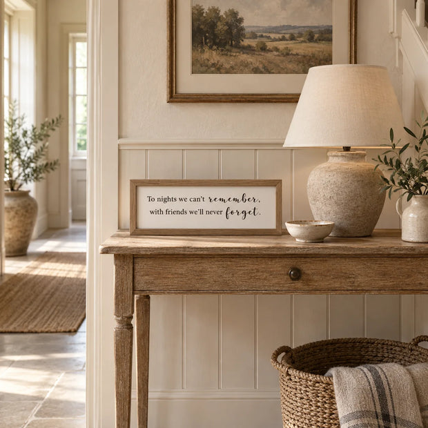 To Nights framed sign styled on an oak console in a classic modern country hallway
