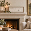 To Nights framed sign styled on a limestone mantel in a classic modern country living room