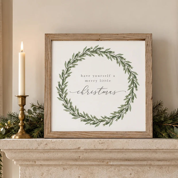 Oak-framed Have Yourself a Merry Little Christmas canvas sign on a mantel