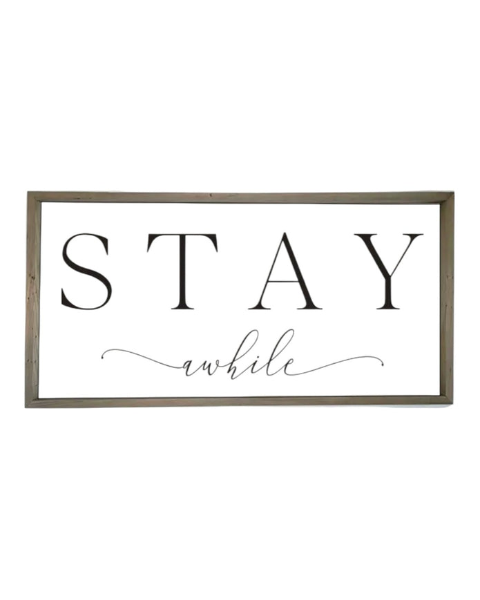 Rustic wooden framed wall art sign by Brayden and Brooks with "Stay A While" message, natural wood finish, large size, pre-order available