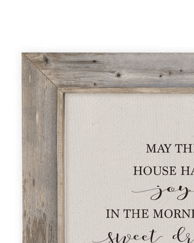 Rustic wooden wall art sign from Brayden and Brooks with “May this house have sweet dreams” framed in natural wood.