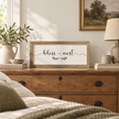 Brayden and Brooks Bless This Nest medium rustic oak sign, approximately 41 x 18 cm styled at true scale in a classic modern country interior, view 3.