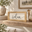 Brayden and Brooks Relax medium rustic oak sign, approximately 41 x 18 cm styled at true scale in a classic modern country interior, view 2.