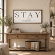 Brayden and Brooks Stay A While large rustic oak sign, 122 x 61 cm styled at true scale in a classic modern country interior, view 1.