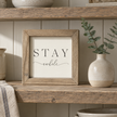 Brayden and Brooks Stay Awhile small rustic oak sign, 20 x 20 cm, styled at true scale in a classic modern country interior, view 1.