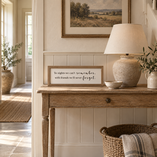 To Nights framed sign styled on an oak console in a classic modern country hallway