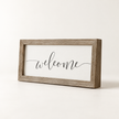 Brayden and Brooks Welcome medium rustic oak sign, approximately 41 x 18 cm, angled studio view on white.