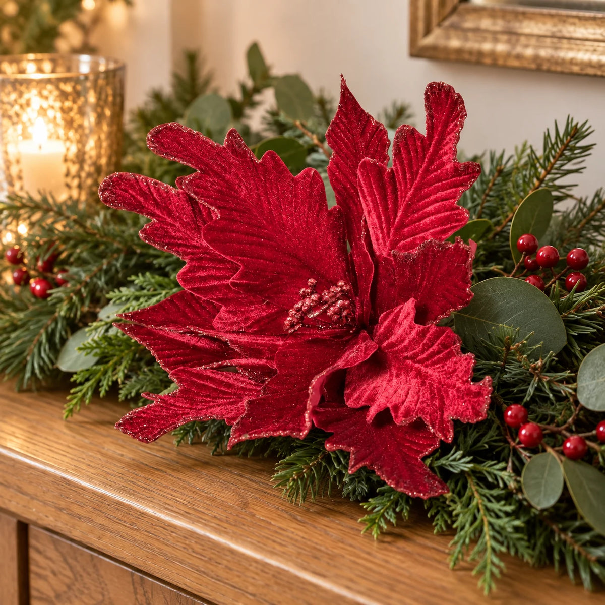 Brilliant Burgundies Style 2 decorative flower among greenery and berries on an oak console.