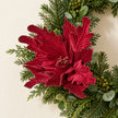 Burgundy Style 2 decorative flower styled among green festive foliage.