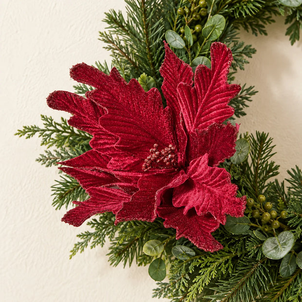 Burgundy Style 2 decorative flower styled among green festive foliage.