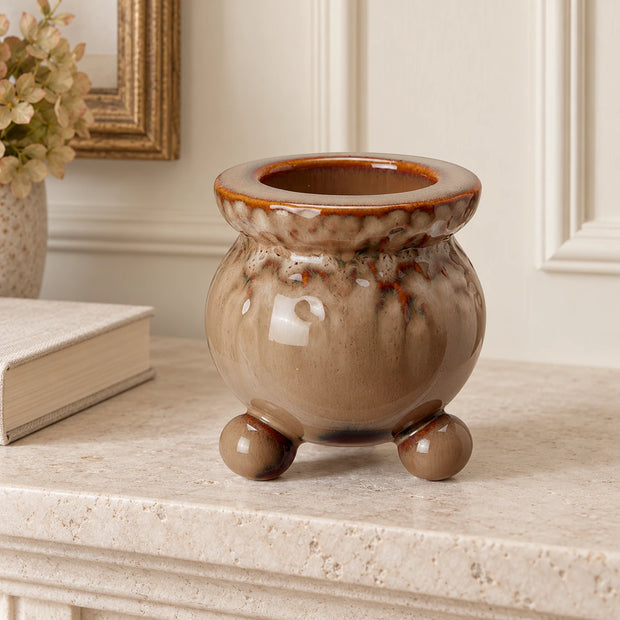 Brown Bobble Candle Holder — Single empty holder on pale stone fireplace mantel