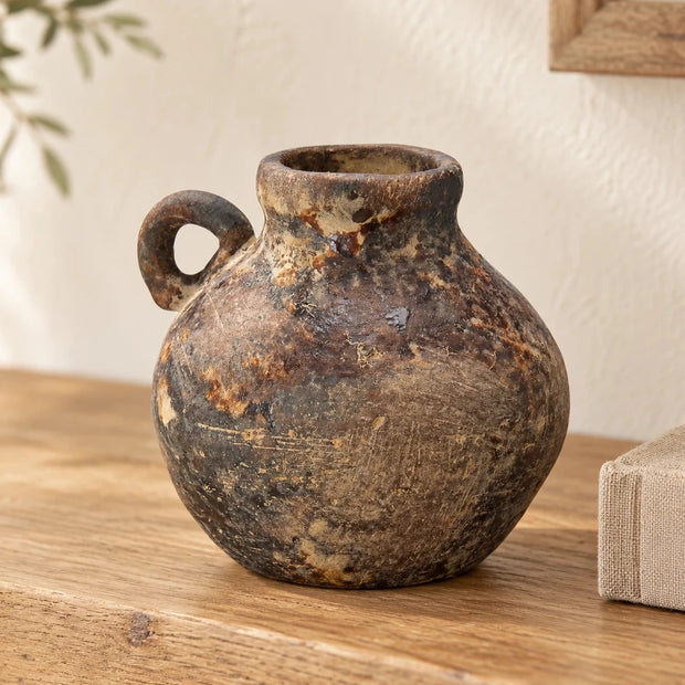 Brown Ceramic Flagon Jug Vase — One vase empty on oak shelf beside linen book